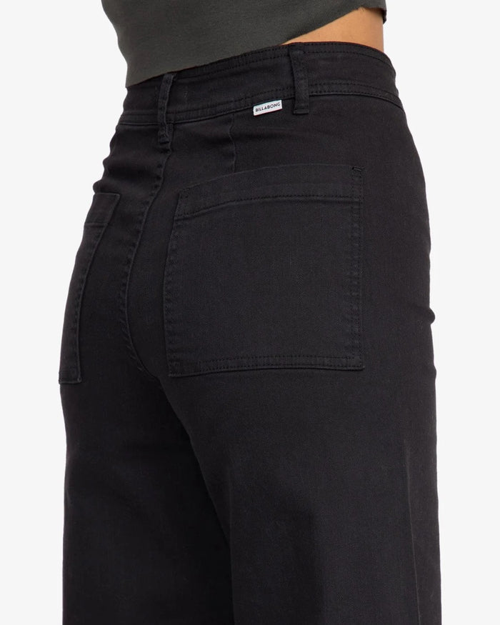 Billanbong black free fall pants with a visible brand logo on a white background