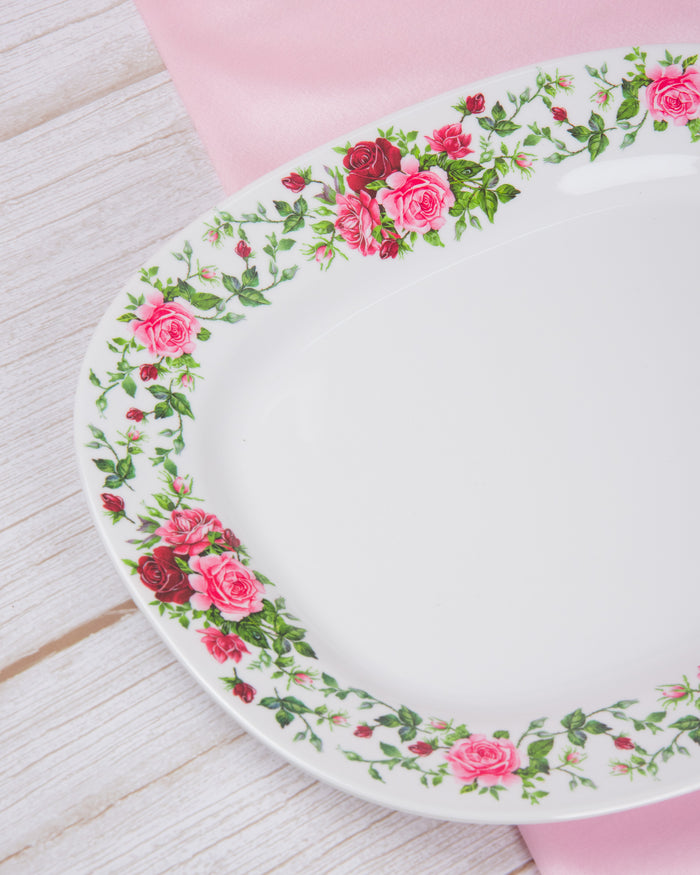 Oval white serving plate with pink roses and green vine floral border