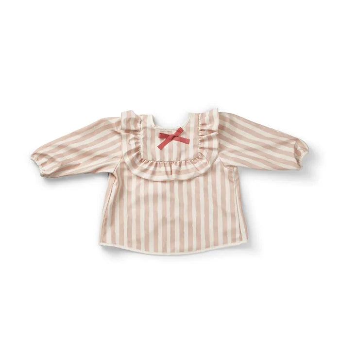 Striped pink and white baby bib with a bow on a white background