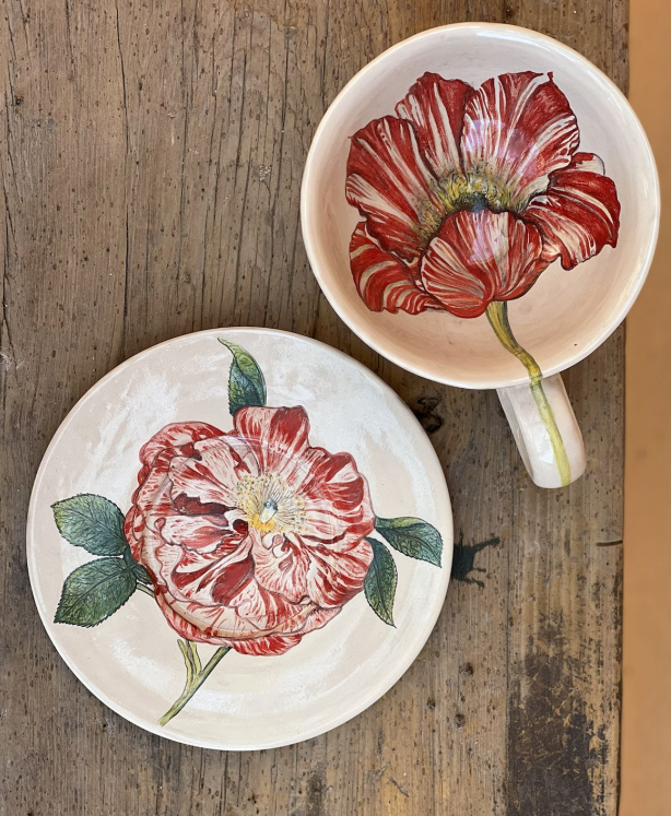 Hand painted botanical tea cup and saucer with a red tulip motif. Perfect for high tea.