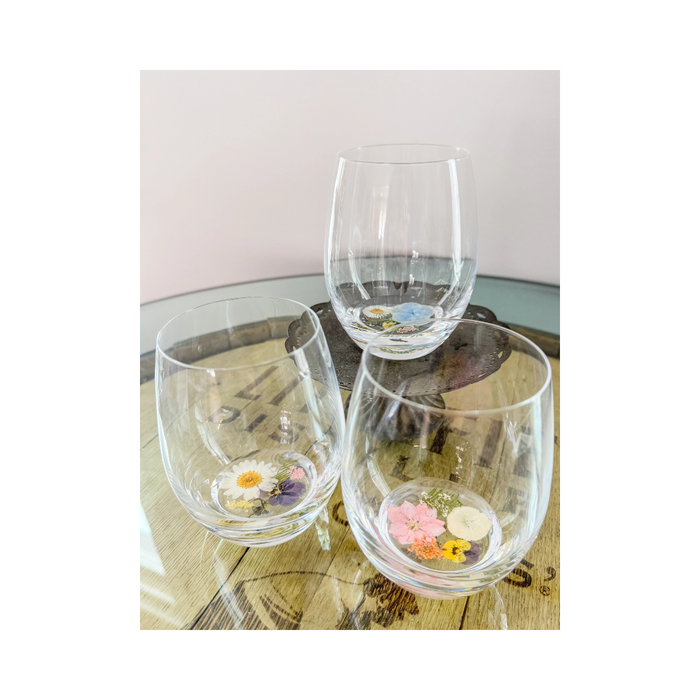 Crystal flower stemless wine glass made with real flowers in resin for an elegant sip. Perfect for spring summer soirees.