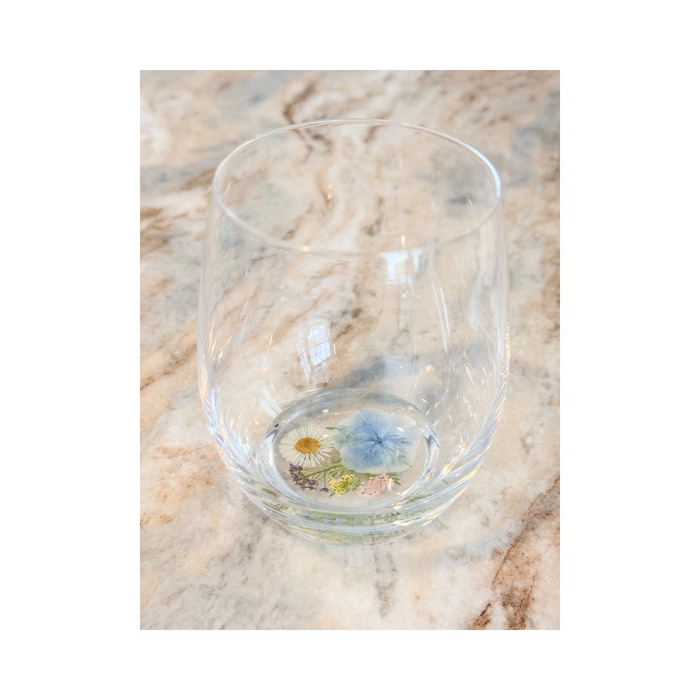 Crystal flower stemless wine glass made with real flowers in resin for an elegant sip. Perfect for spring summer soirees.