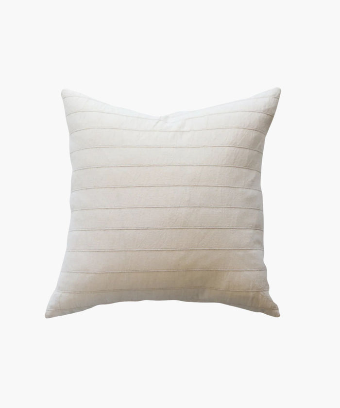 Square beige pillow with a textured pattern on a white background.  | Wildwood Home Co.