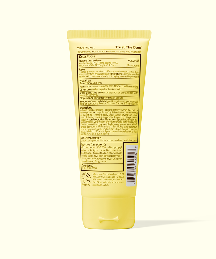 Yellow tube of sunscreen with label on a white background