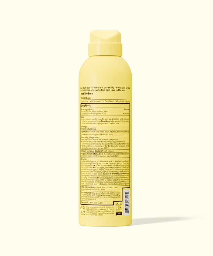 Yellow bottle with label on a white background