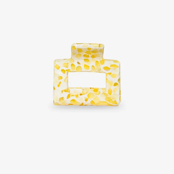 Yellow textured square sasstie hair clip on a white background