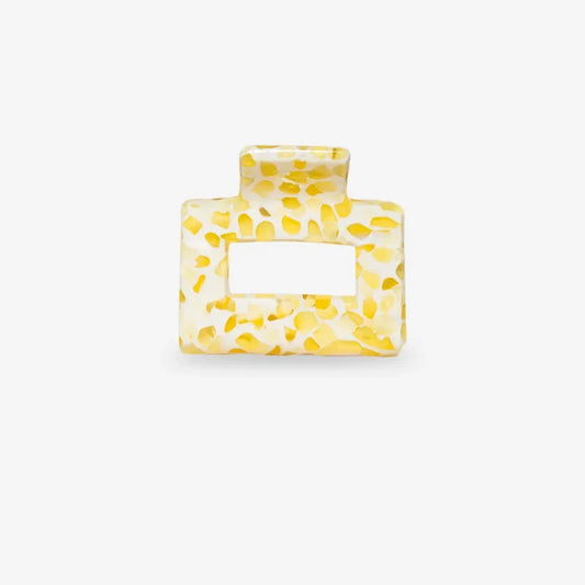 Yellow textured square sasstie hair clip on a white background