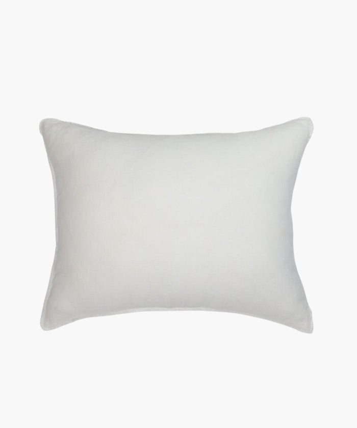 Rectangular ivory linen pillow on a white background highlighting fabric texture, stitching, and finish. | Wildwood Home Co.