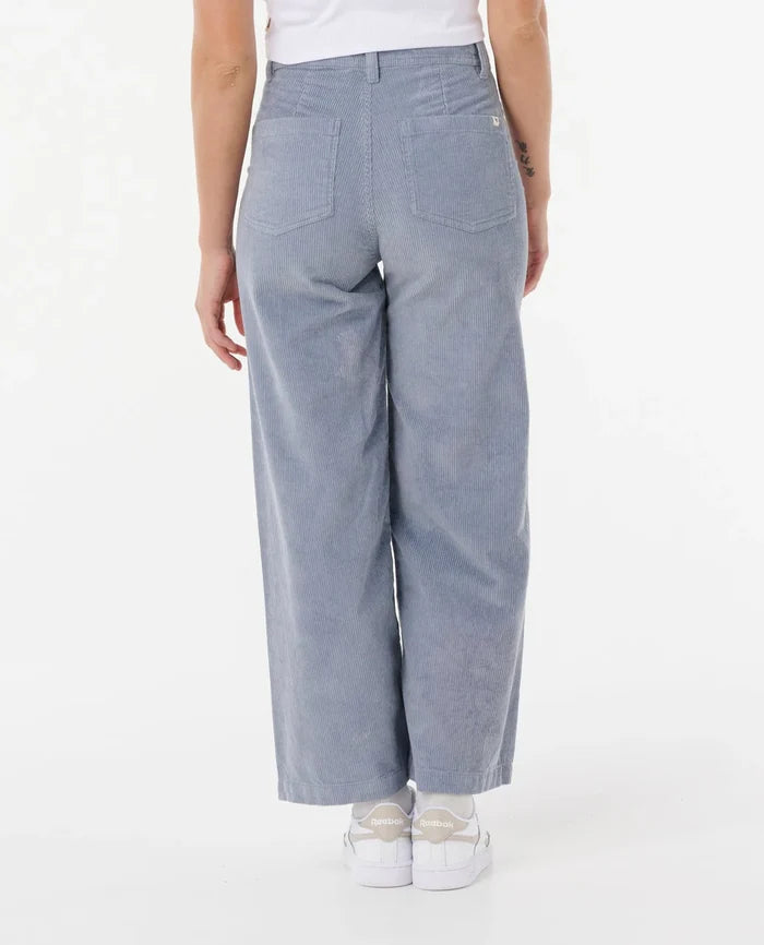 Light blue pants worn by a person on a white background