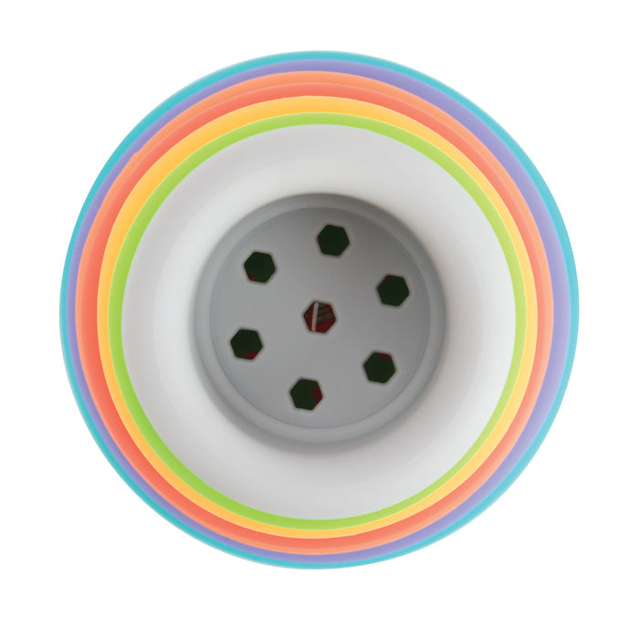 A top-down view of Silicone Stacking Cups shows a white cup in the center, surrounded by blue, green, yellow, orange, and pink-rimmed cups. Their vibrant concentric pattern makes these cups ideal for baby development.
