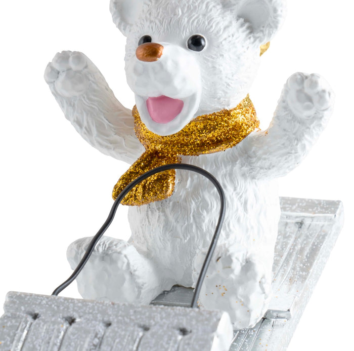 Michael Aram sledding teddy ornament, metal with playful design, for whimsical decoration.