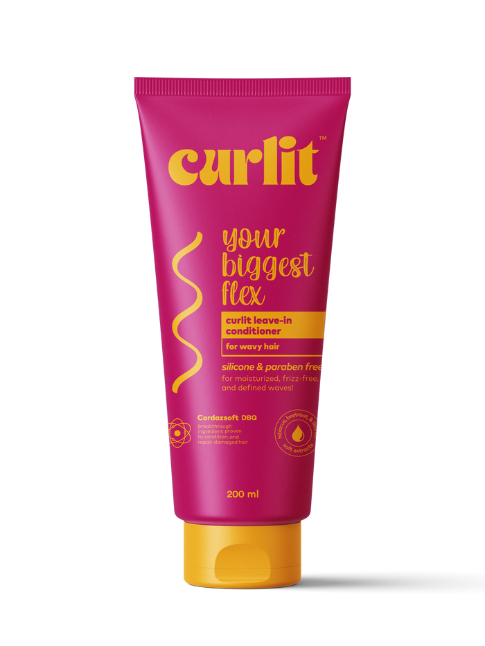 Curlit Wavy Leave-In Conditioner in pink bottle for lightweight hydration and soft wave definition